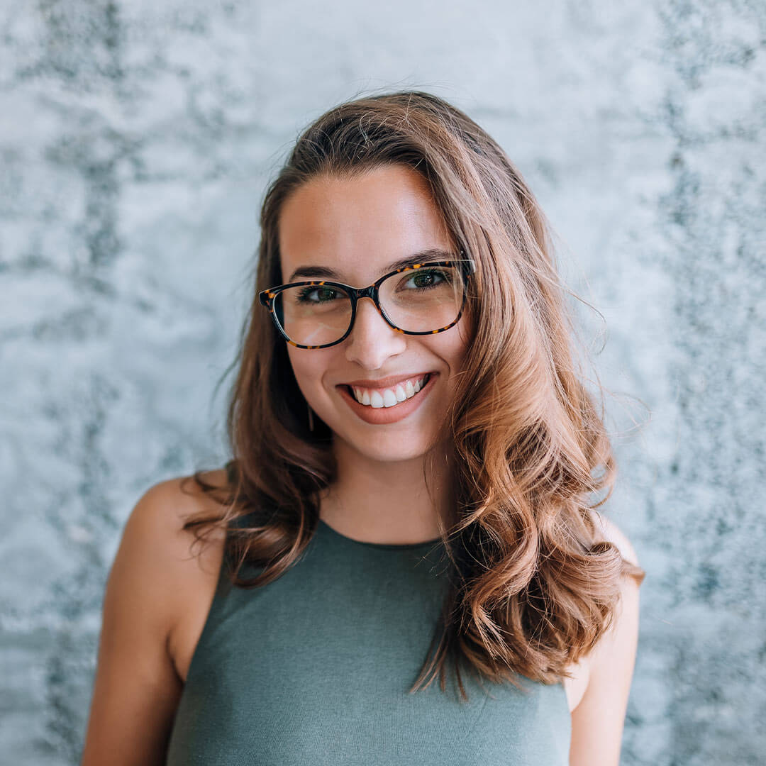 Woman with glasses smiling