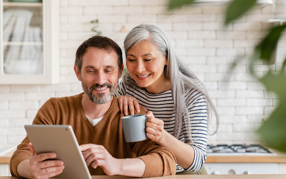 older couple looking at a tablet