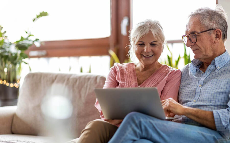 Older couple looking at a tablet - Northshore Family Dentistry