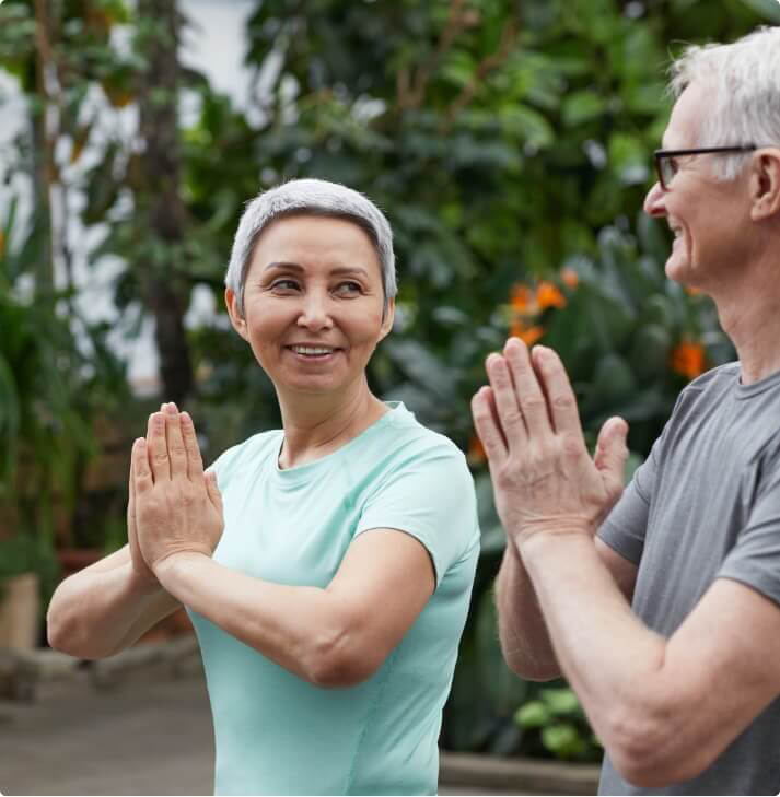 Older couple doing yoga